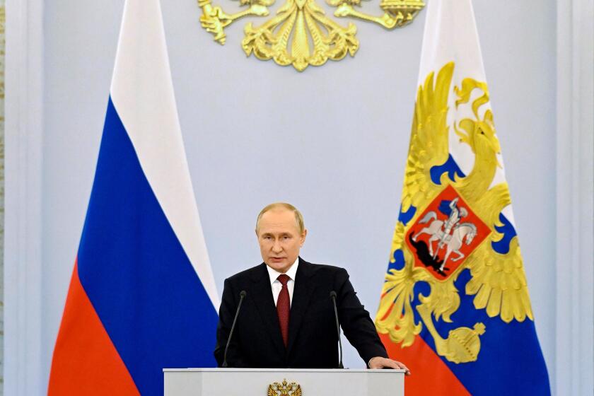Russian President Vladimir Putin speaks during a ceremony to sign the treaties for four regions of Ukraine to join Russia in the Kremlin in Moscow, Russia, Friday, Sept. 30, 2022. The signing of the treaties making the four regions part of Russia follows the completion of the Kremlin-orchestrated "referendums." (Grigory Sysoyev, Sputnik, Kremlin Pool Photo via AP)