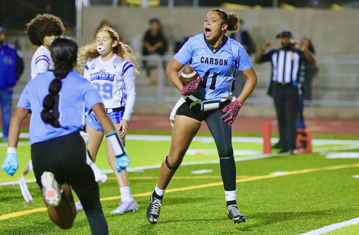 L.A. Marshall defeats Eagle Rock for Metropolis Part Open Division flag soccer title 3 Carson receiver Kiara Chukwudi celebrates after scoring a touchdown.