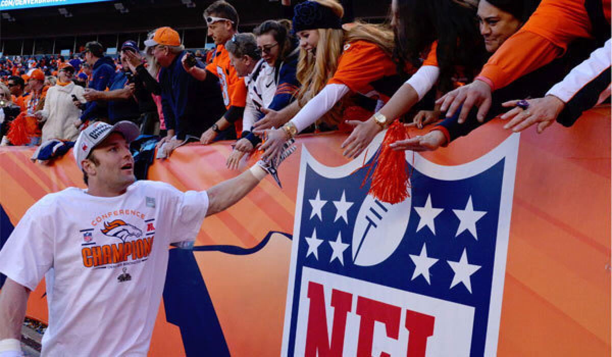 Denver receiver Wes Welker reaches out to the fans following the Broncos' win over the New England Patriots in the AFC championship game Sunday.