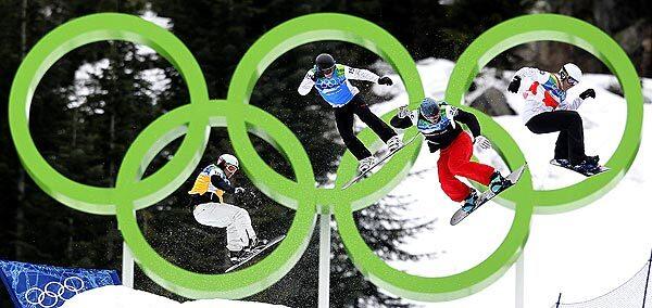 Canada's Robert Fagan, right, leads Germany's David Speiser, Canada's Francois Boivin and Swizerland's Fabio Caduff in a men's snowboard cross quarterfinal at Cypress Mountain in Vancouver, Canada.