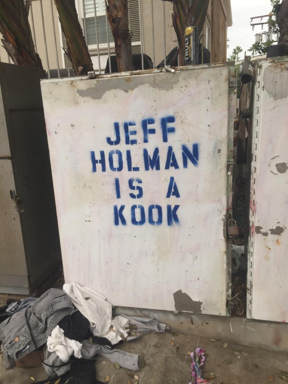 A tagger made a stencil to paint this utility box message attacking a resident who had reported graffiti to city officials.