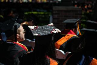 LOS ANGELES, CA - MAY 13: A graduate with a decorated cap attends The University of Southern California's commencement ceremony on Friday, May 13, 2022 in Los Angeles, CA. (Jason Armond / Los Angeles Times)