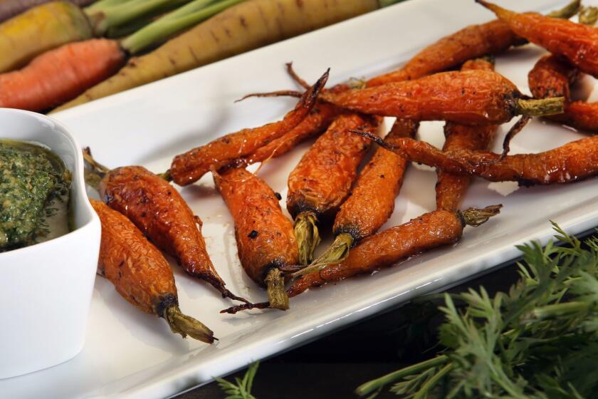 LOS ANGELES CA.SEPTEMBER 13, 2017: ROASTED CARROTS WITH CARROT TOP PESTO was photographed at the Los Angeles Times studio on September 13, 2017. (Glenn Koenig/Los Angeles Times)