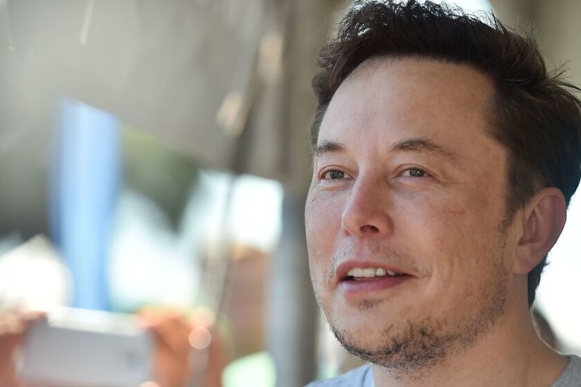 (FILES) In this file photo taken on July 22, 2018 SpaceX, Tesla and The Boring Company founder Elon Musk attends the 2018 SpaceX Hyperloop Pod Competition, in Hawthorne, California. - Tesla CEO Elon Musk said in a blog posting Friday, August 24, 2018, that his company would continue to be publicly traded, weeks after suggesting that he would take the electric carmaker private. Musk met with Tesla's board of directors on Thursday "and let them know that I believe the better path is for Tesla to remain public. The Board indicated that they agree," he wrote on the company blog. (Photo by Robyn Beck / AFP)ROBYN BECK/AFP/Getty Images ** OUTS - ELSENT, FPG, CM - OUTS * NM, PH, VA if sourced by CT, LA or MoD **