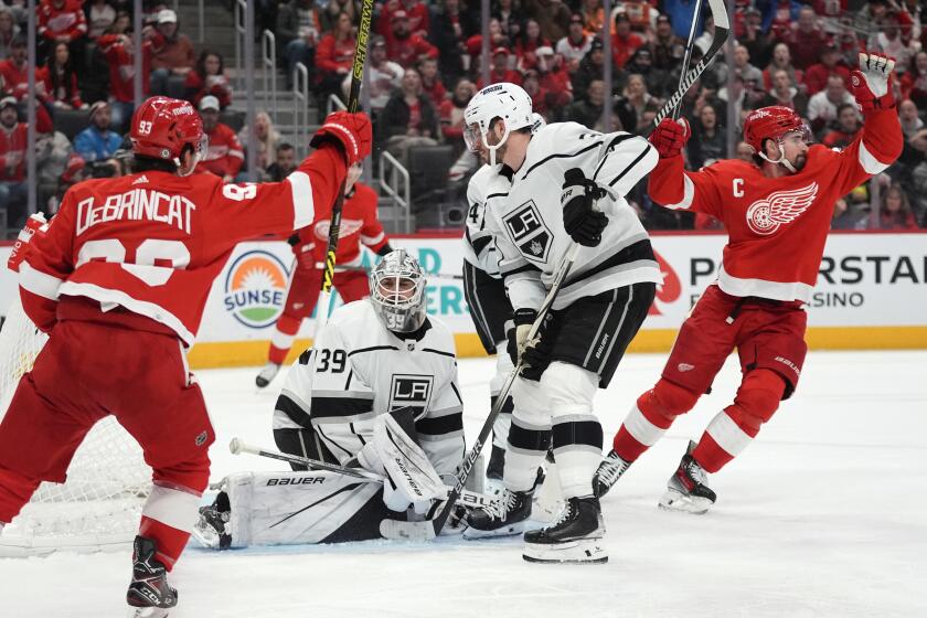 Detroit Red Wings center Dylan Larkin, right, celebrates his goal against the Los Angeles Kings.