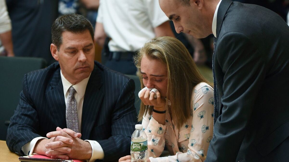 Michelle Carter cries while flanked by defense attorneys Joseph Cataldo, left, and Cory Madera, after being found guilty of involuntary manslaughter.
