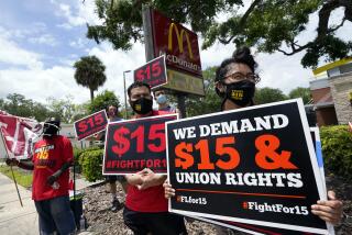 FILE - Workers and family members take part in a 15-city walkout to demand $15 per hour wages on May 19, 2021, in front of a McDonald's restaurant in Sanford, Fla. A federal rule that goes into effect next month could make it easier for millions of workers to form unions at big companies like McDonald's. But it's already facing significant pushback from businesses and some members of Congress. (AP Photo/John Raoux, File)