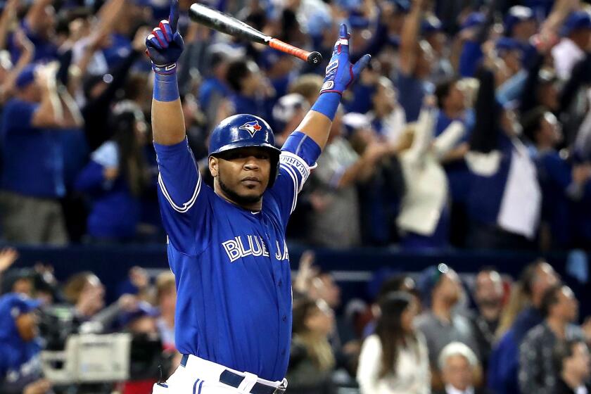 Blue Jays first baseman Edwin Encarnacion reacts after hitting the game-winning three-run home run against the Orioles on Tuesday night in Toronto.
