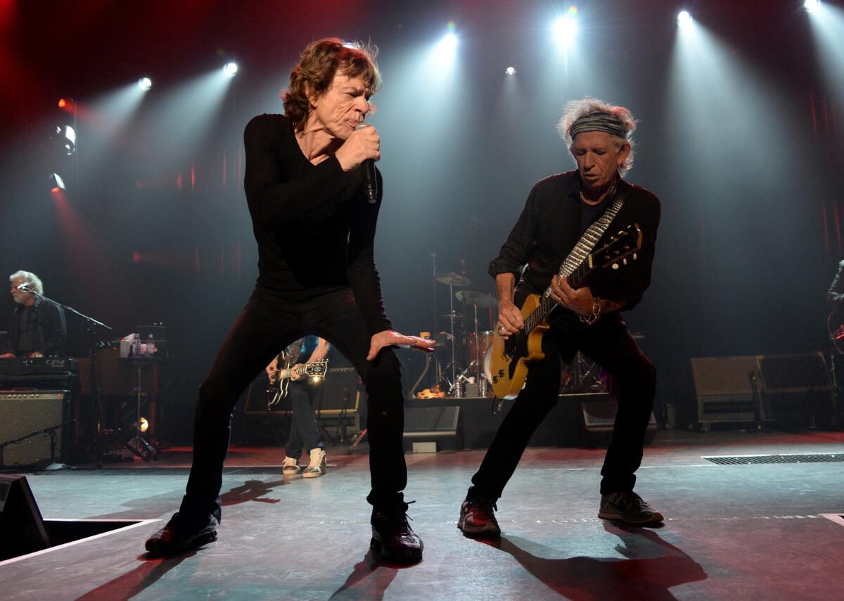 Mick Jagger, left, and Keith Richards, shown performing in Los Angeles in May, will hit the road once again in 2016 for a tour of South America.