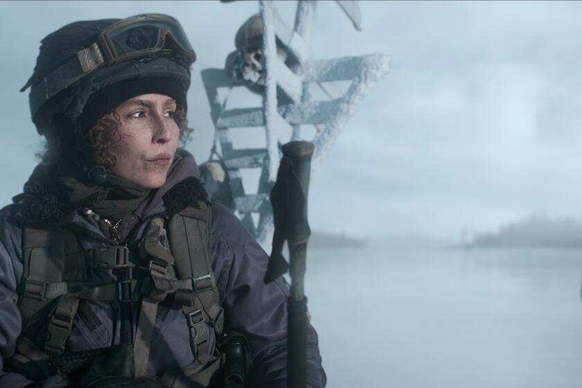 A woman wearing military snow gear in the movie "Black Crab."
