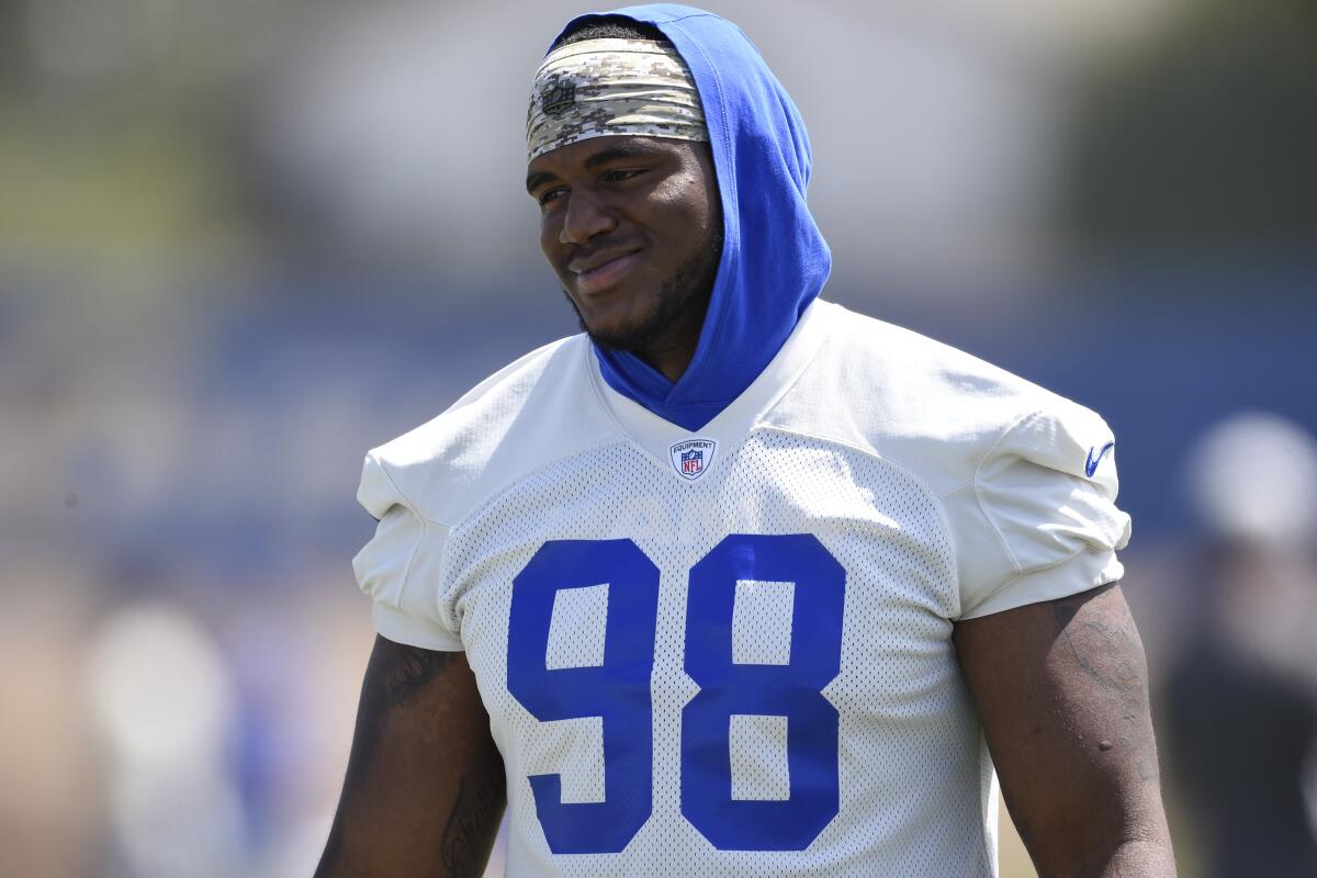 Former Rams' defensive lineman Eric Banks walks on the field during practice in Thousand Oaks. 