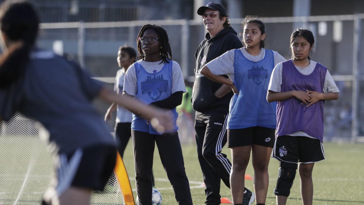 Downtown Los Angeles Soccer Club coach Mick Muhlfriedel supervises a practice at Liechty Middle School.