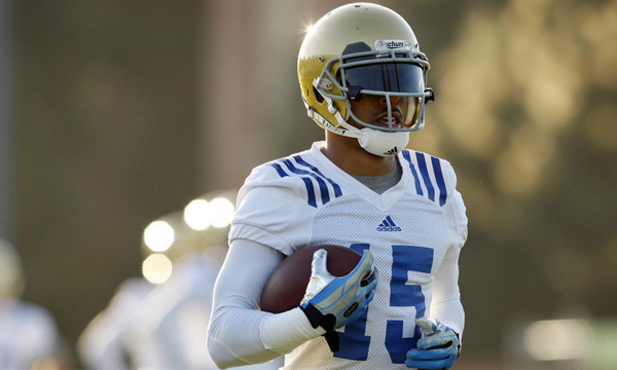 UCLA wide receiver Devin Lucien takes part in an early morning practice session at Spaulding Field on the UCLA campus on Tuesday. Lucien is taking a different approach to his game as he prepares for his junior season.