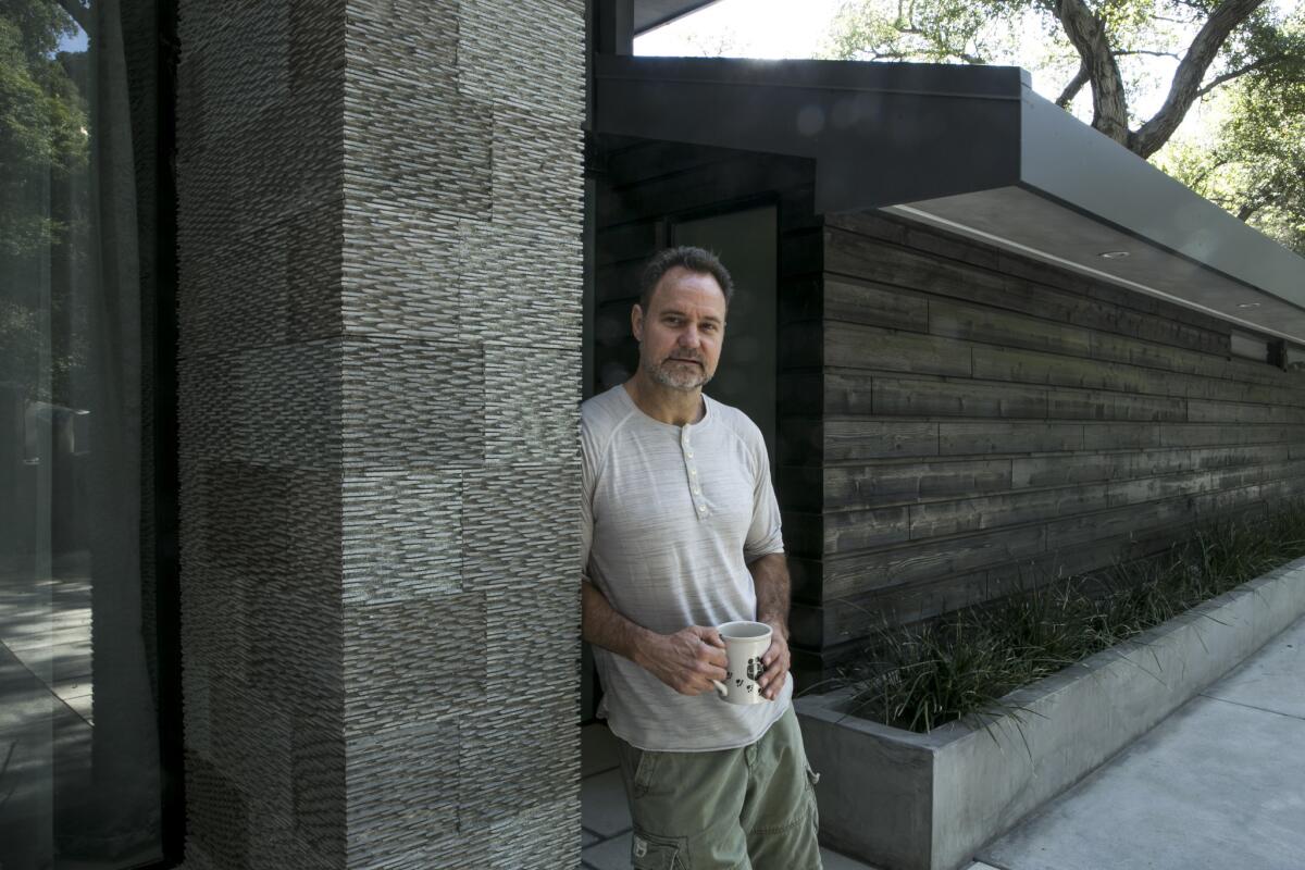 Architect Christopher Mercier outside the 1950s home he renovated for Sunnie Kim.