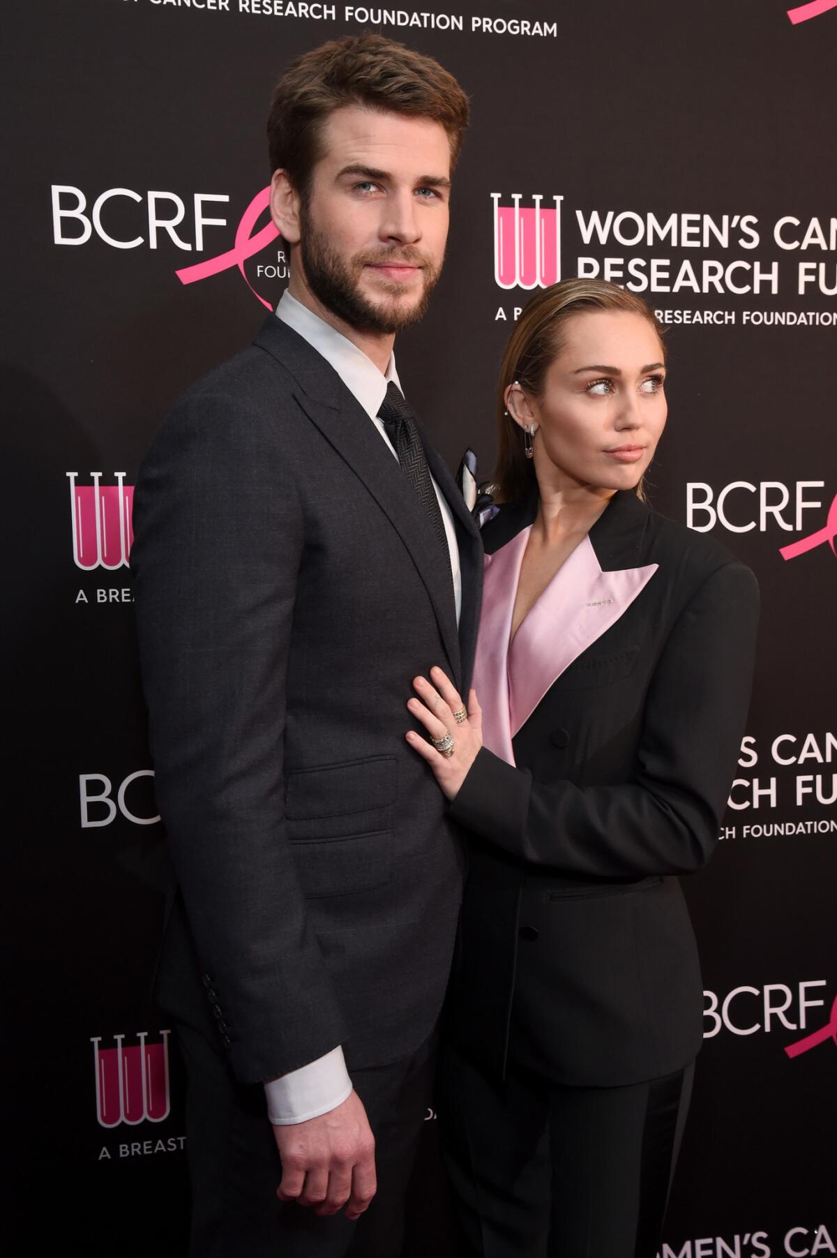 Liam Hemsworth, left, and Miley Cyrus at WCRF's An Unforgettable Evening.