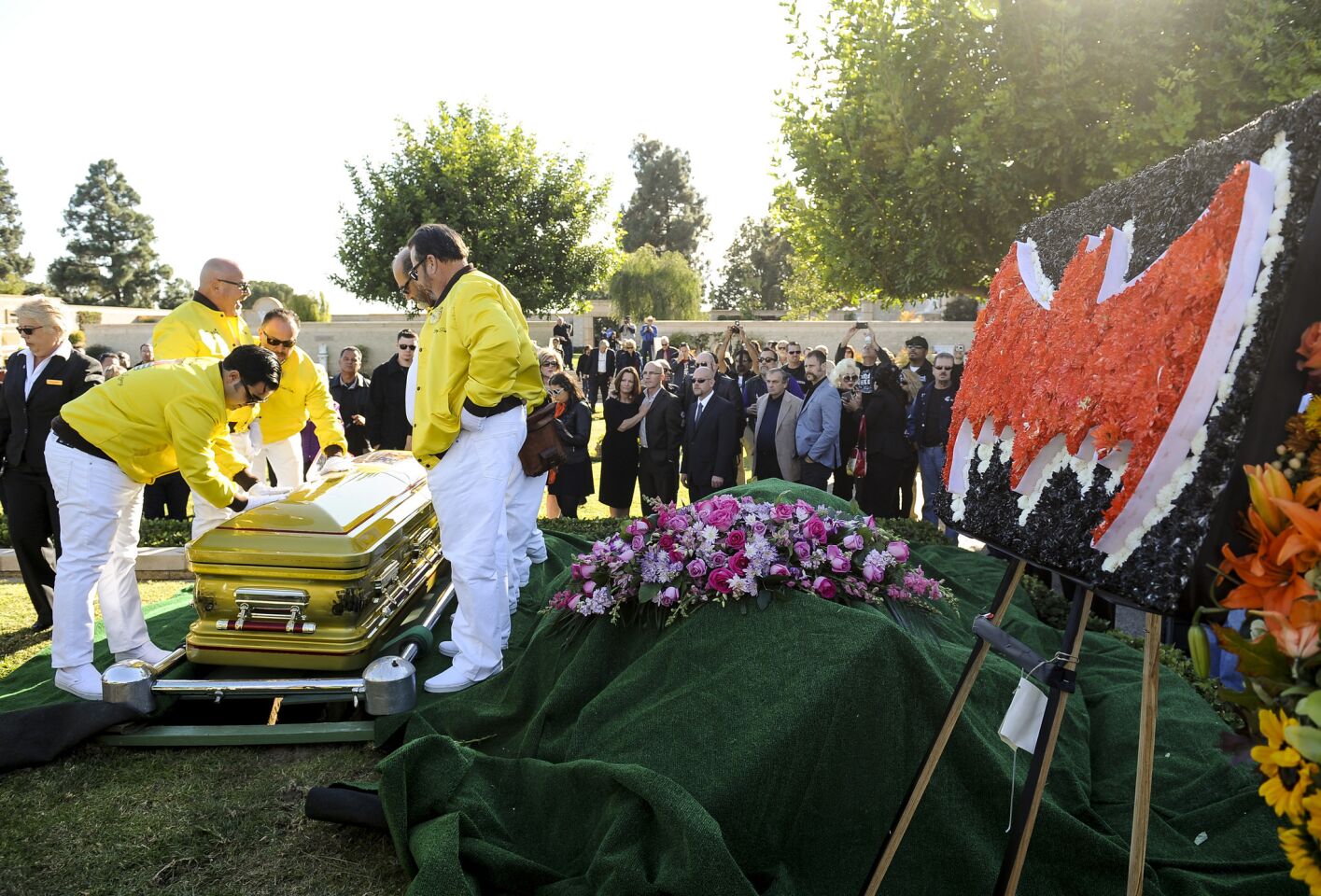 Pallbearers set George Barris' custom-painted casket down at Forest Lawn Glendale on Saturday. Barris died Nov. 5 at his Encino home.