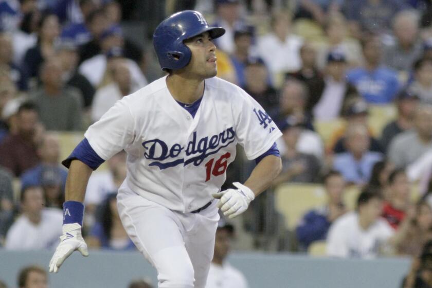 Outfielder Andre Ethier, watching a home run against Cincinnati last season, is still a question mark for the Dodgers.