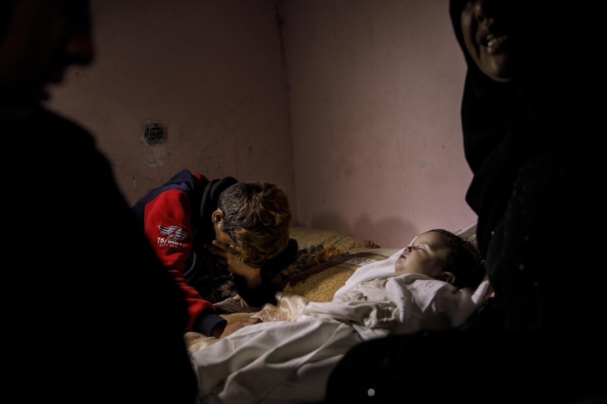 Ammar Rezeq, 12, grieves for his niece Layla Ghandour. Her family says the 10-month-old died after being exposed to tear gas in the Gaza Strip. A doctor says she had a preexisting heart condition.