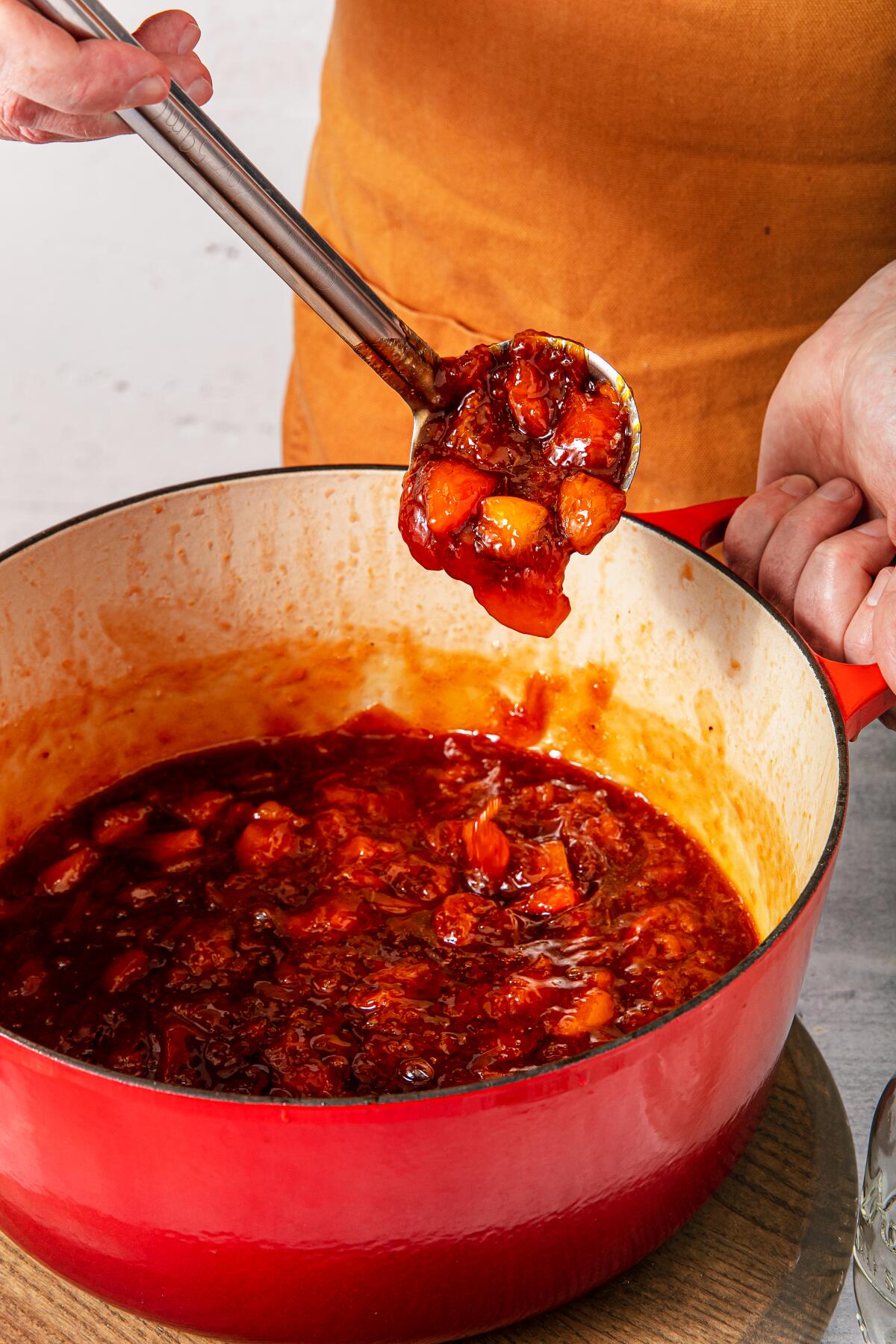 A spoonful of the chopped fruit mixture.