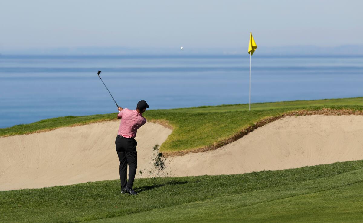 Tiger Woods hits on on the 4th hole at the Torrey Pines Golf Course 