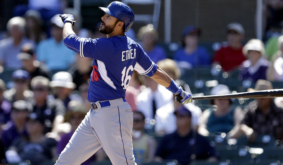 Dodgers outfielder Andre Ethier, who will probably begin the season as a reserve, watches his two-run home run against Rockies during an exhibition game March 21.