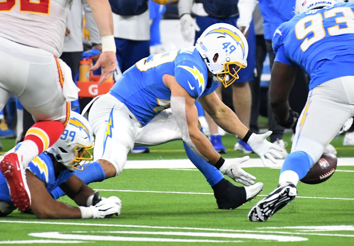 Chargers linebacker Drue Tranquill recovers a fumble by Chiefs quarterback Patrick Mahomes in the second quarter.