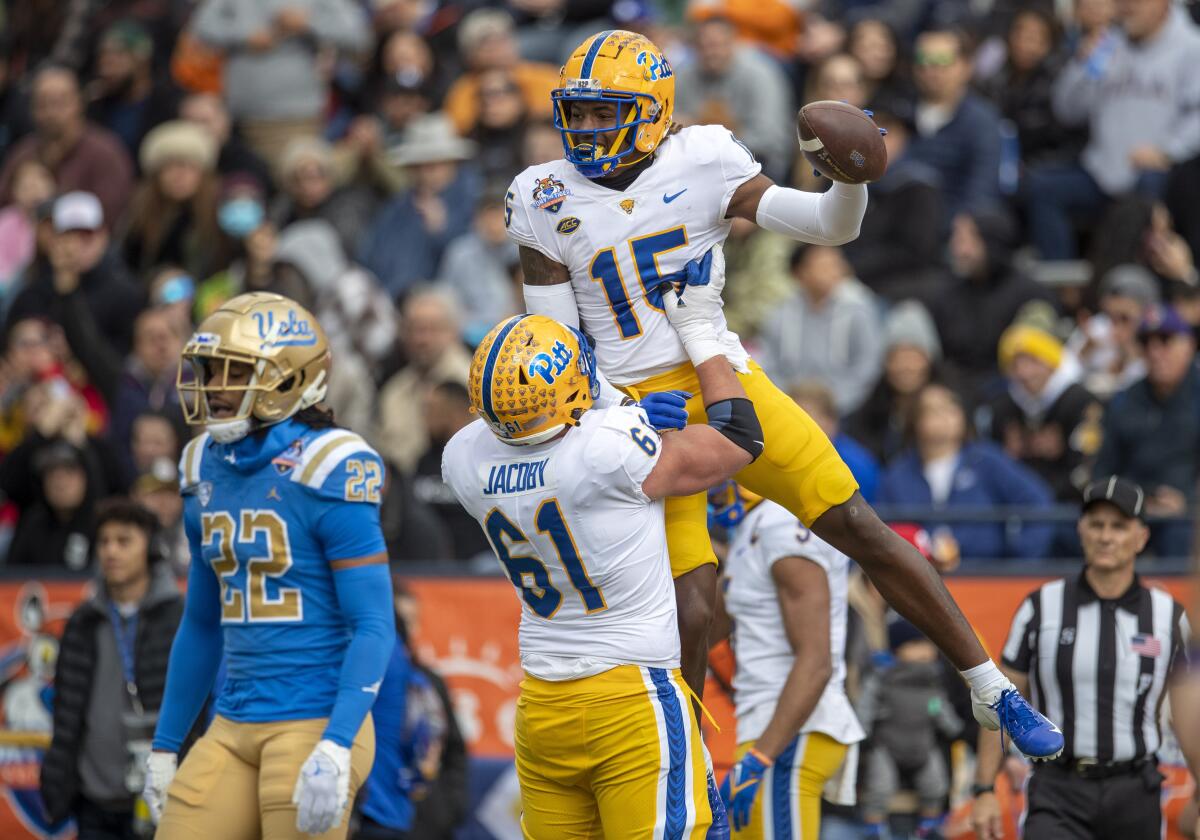 Pittsburgh wide receiver Bub Means (15) celebrates after a touchdown against UCLA.