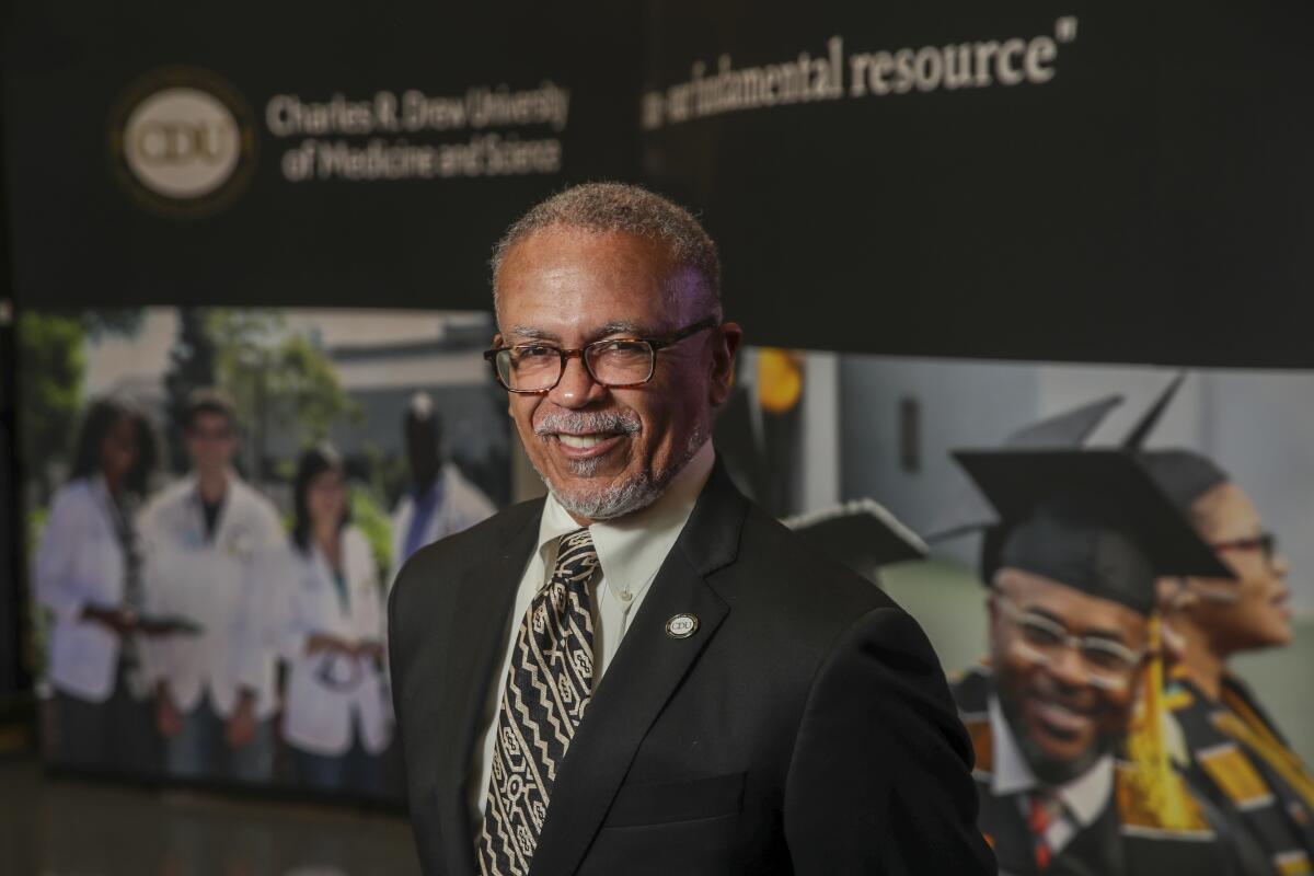 Dr. David M. Carlisle smiles in a portrait.