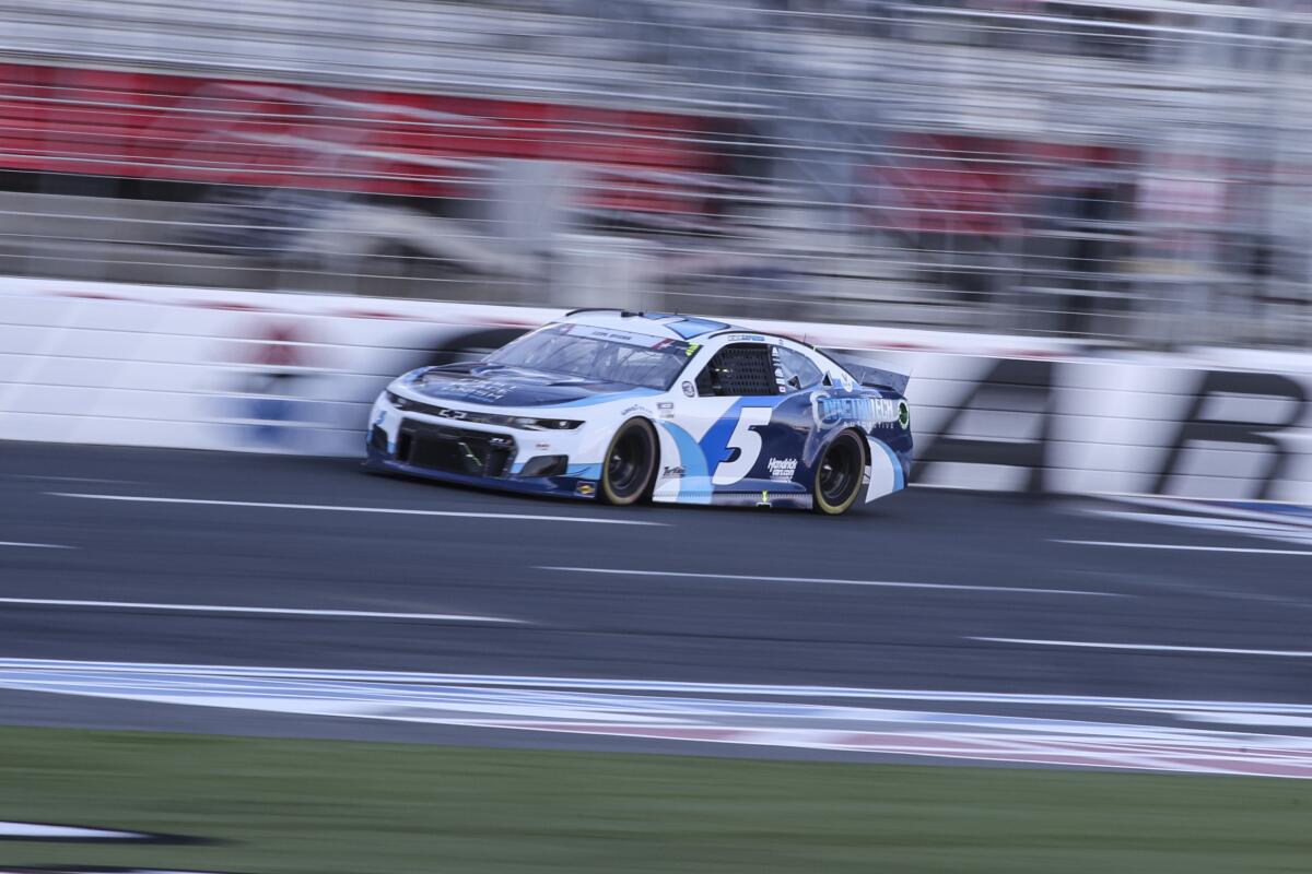 Kyle Larson races to victory in Sunday's NASCAR Cup race at Charlotte Motor Speedway.