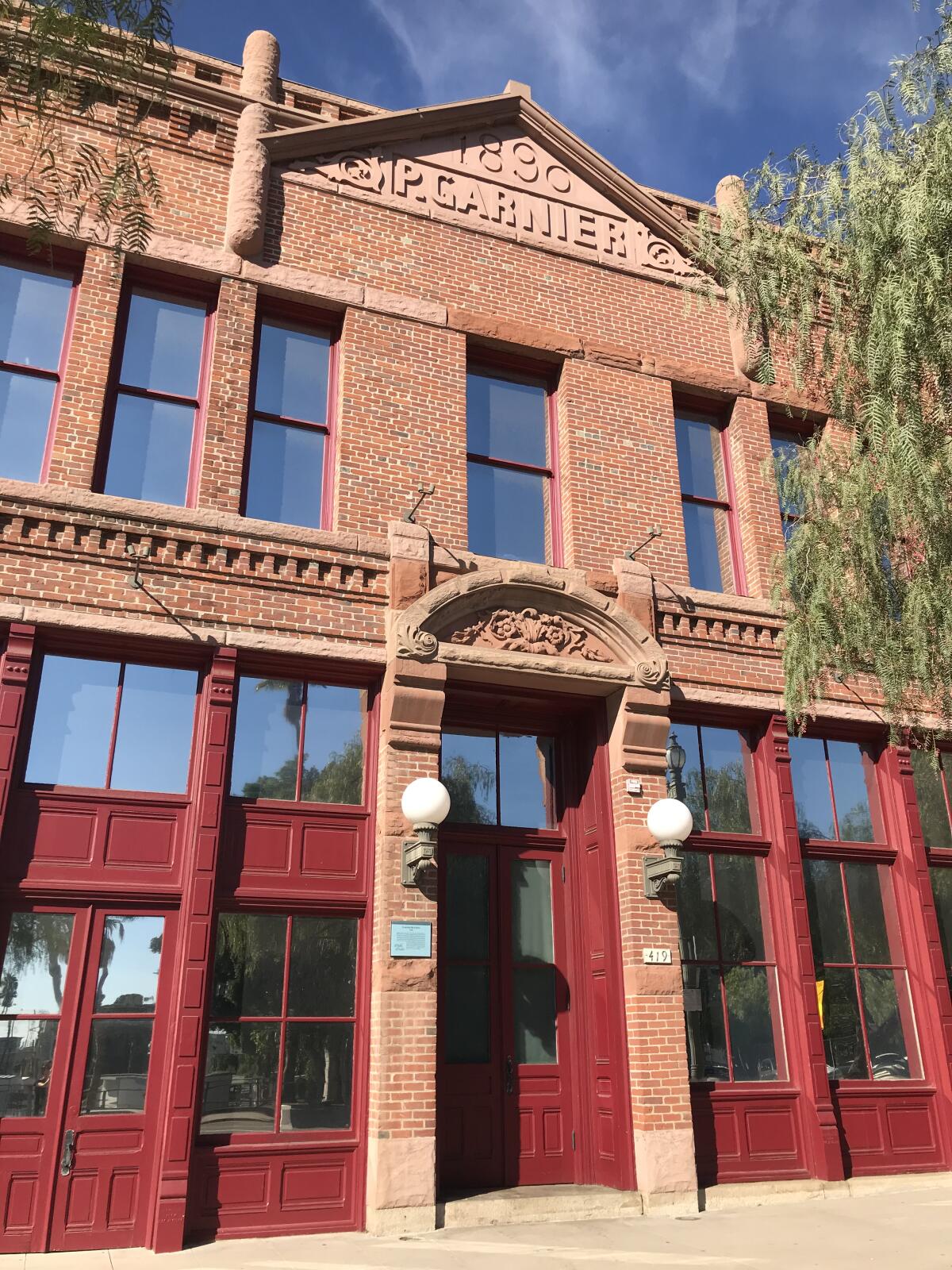 The red brick facade of the Garnier Building in downtown Los Angeles