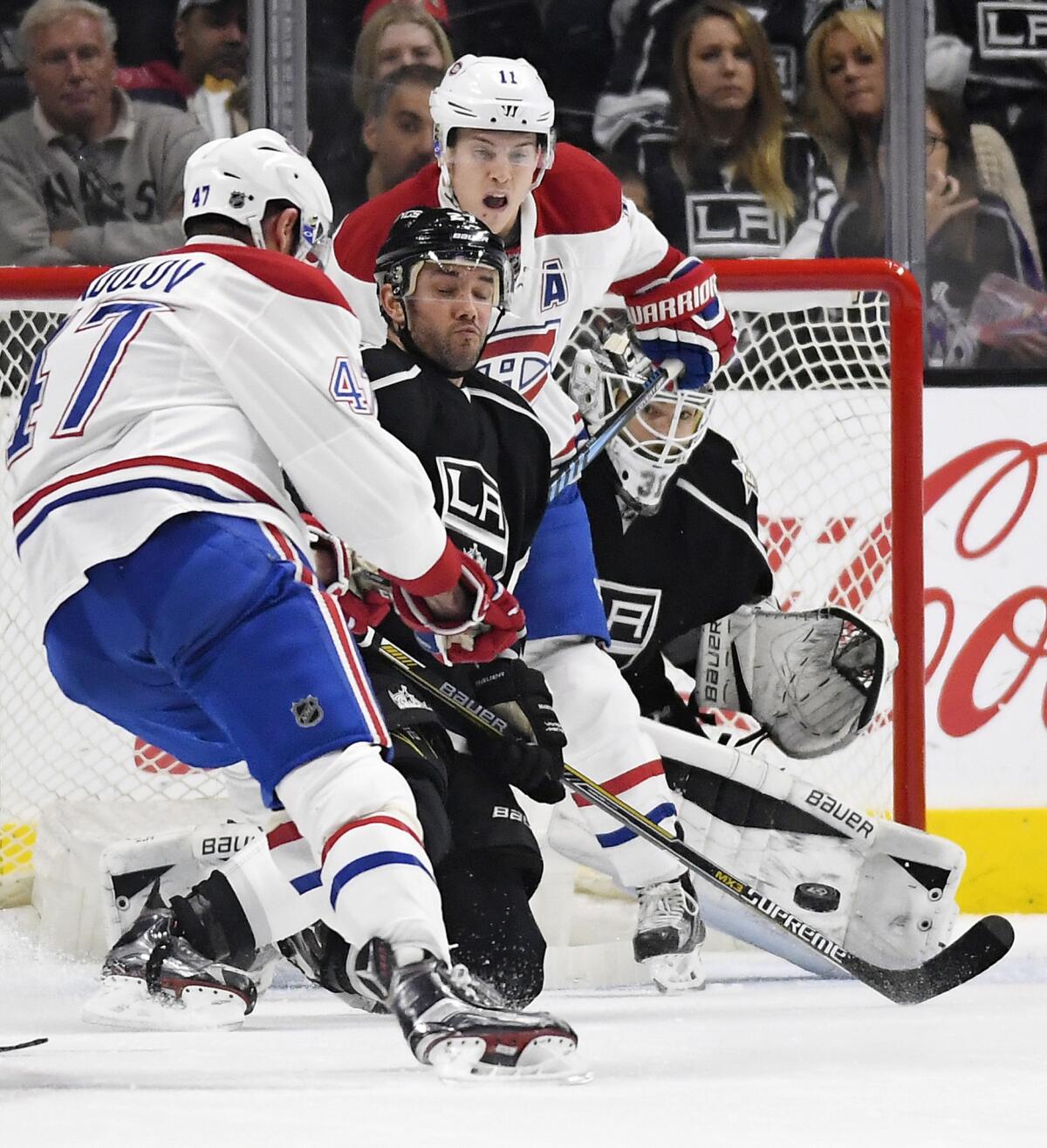 Canadiens right wing Alexander Radulov, left, scores on Kings goalie Peter Budaj, right, as defenseman Alec Martinez tries to stop the shot and Canadiens right wing Brendan Gallagher positions himself in front during the second period.