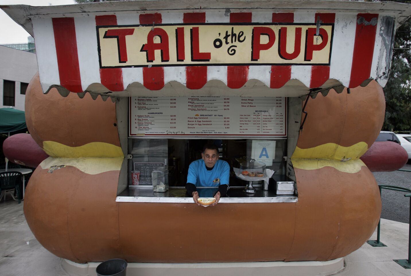 Dennis Blake, in 2005, worked at the Tail o' the Pup hot dog stand since 1976 with his father, Eddie Blake, (not pictured).