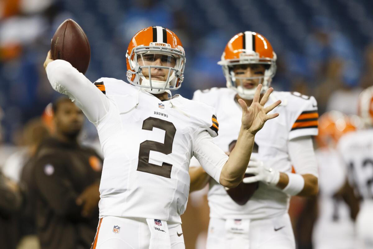 Cleveland Browns quarterback Johnny Manziel, No. 2, throws as Brian Hoyer watches on Aug. 9.