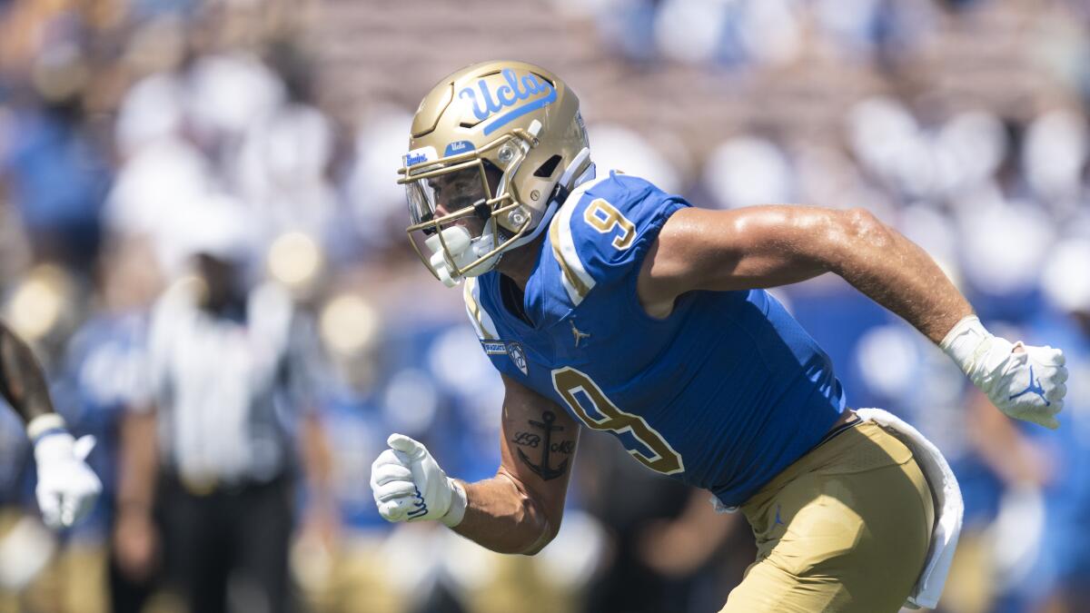 Jake Bobo runs during a UCLA game.