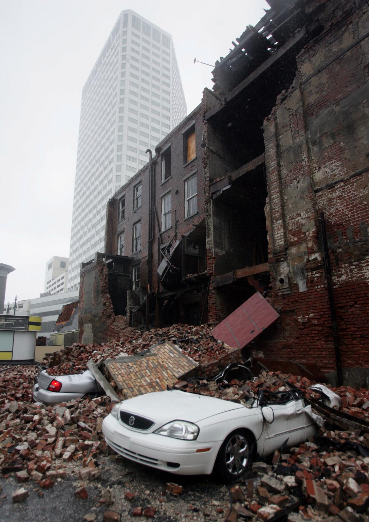 Debris from a fallen building covers streets in downtown New Orleans. (Dave Martin / Associated Press)