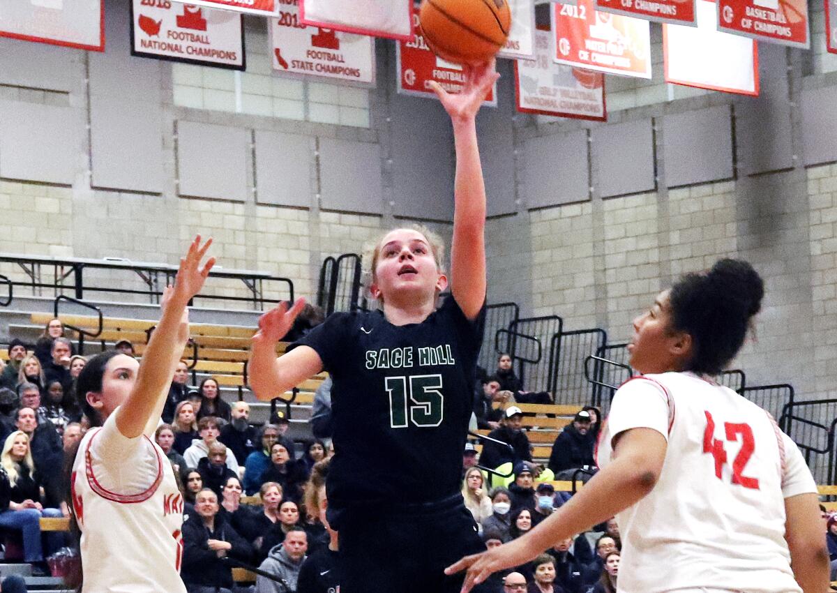 Sage Hill's Annabelle Spotts (15) drives to the basket against Mater Dei on March 1.