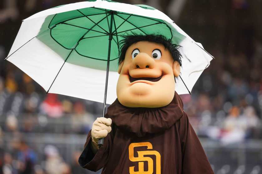 San Diego, CA - March 30: The Friar holds an umbrella before the Padres game against the San Francisco Giants at Petco Park on Saturday, March 30, 2024 in San Diego, CA. (Meg McLaughlin / The San Diego Union-Tribune)