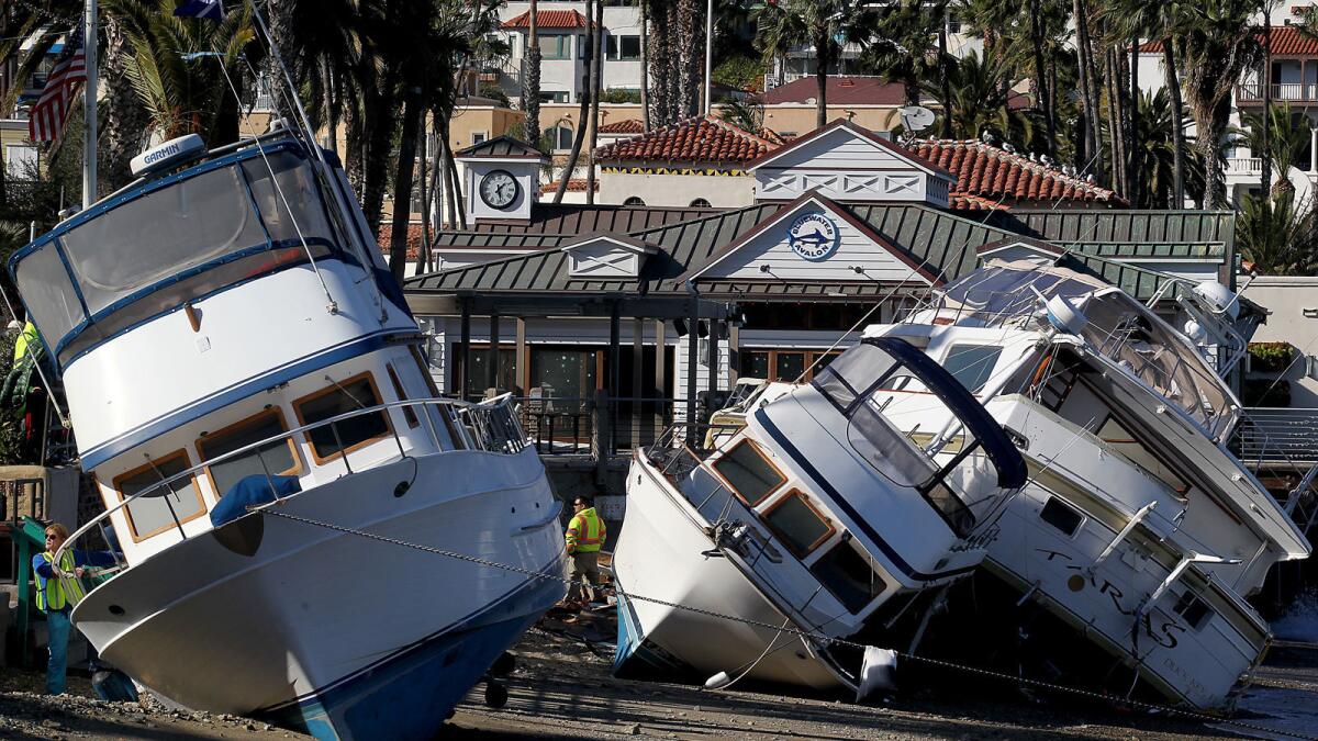 Boats driven ashore by high winds and waves line the beach in Avalon after a storm Dec. 30 wreaked havoc on Catalina Island.
