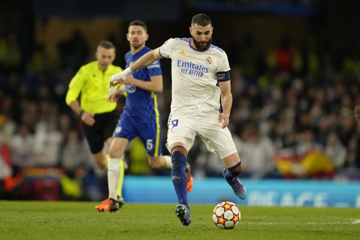 Real Madrid's Karim Benzema controls the ball during a Champions League first-leg quarterfinal soccer match between Chelsea and Real Madrid at Stamford Bridge stadium in London, Wednesday, April 6, 2022. (AP Photo/Kirsty Wigglesworth)