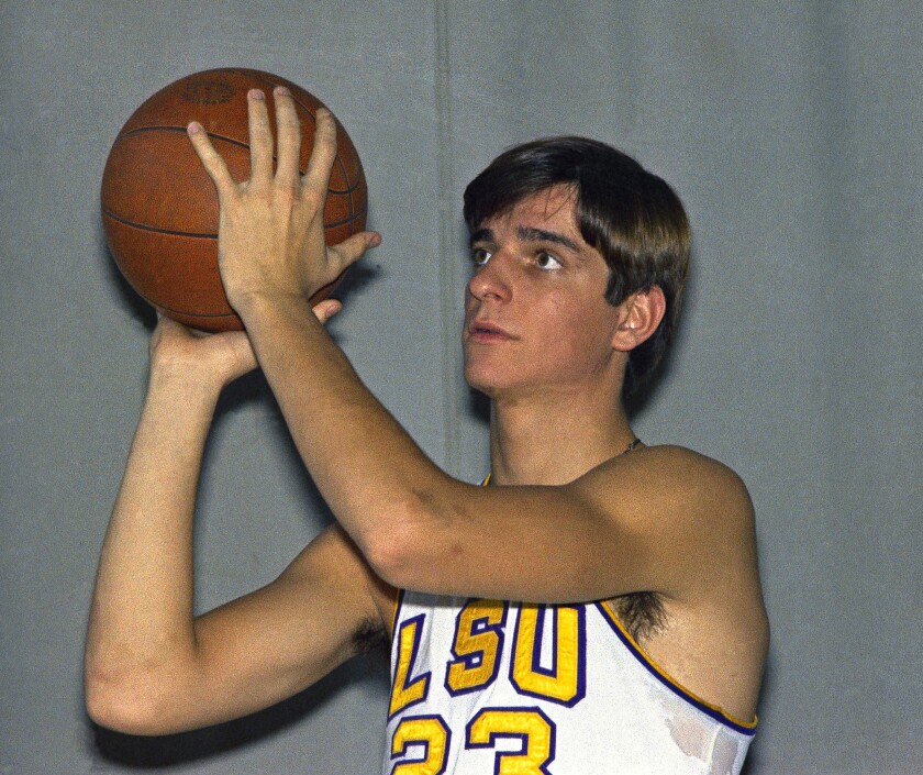 FILE - 'Pistol' Pete, Pete Maravich, basketball player for LSU, in posed action in New Orleans LA., Nov. 1969. More than 50 years after his record-setting basketball career at LSU, “Pistol” Pete Maravich’s college letterman jacket has sold for nearly $117,000 at auction. (AP Photo, File)