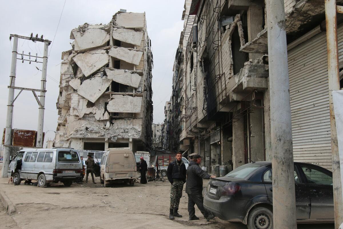 Evidence of years of civil war can be seen in a heavily damaged building in Aleppo, Syria, on Feb. 11.