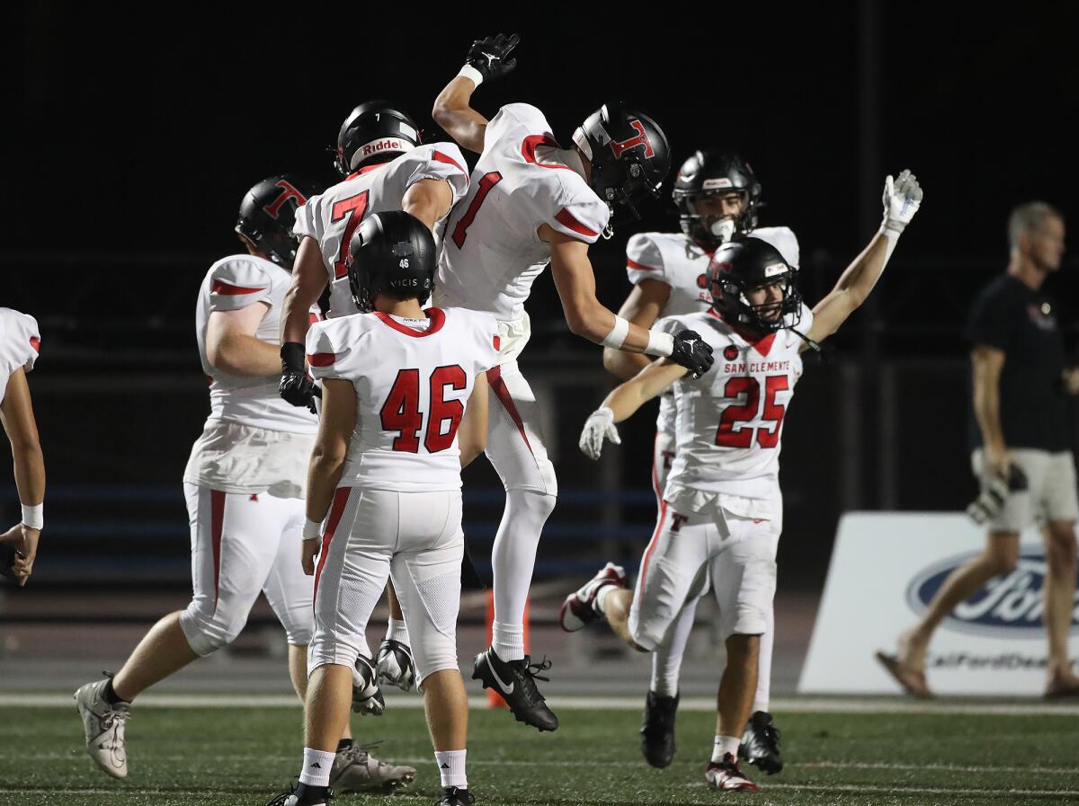 San Clemente celebrates its first touchdown of the game against Corona del Mar on Friday night.