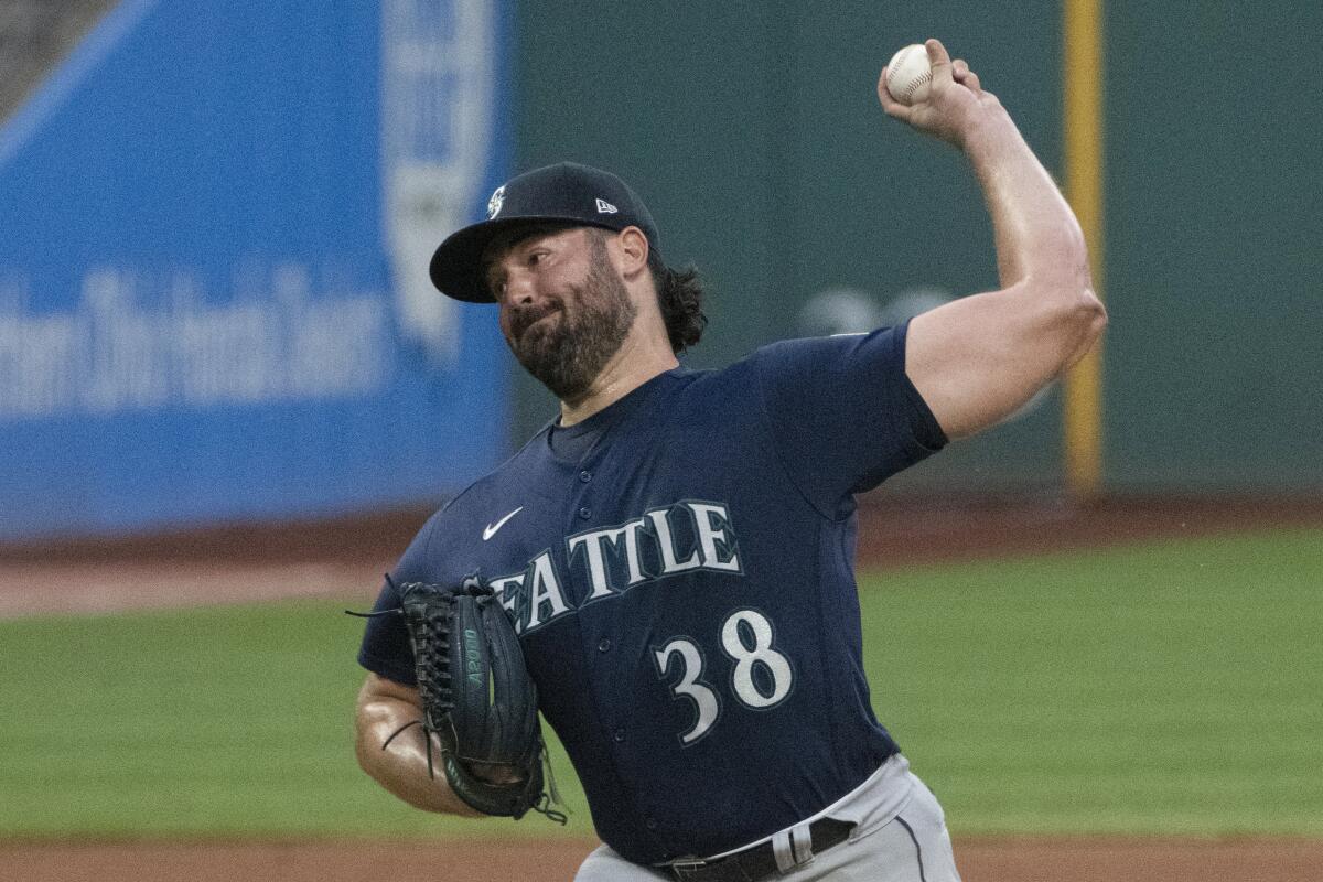 Seattle Mariners starting pitcher Robbie Ray delivers against the Cleveland Guardians during the first inning of a baseball game in Cleveland, Saturday, Sept. 3, 2022. (AP Photo/Phil Long)