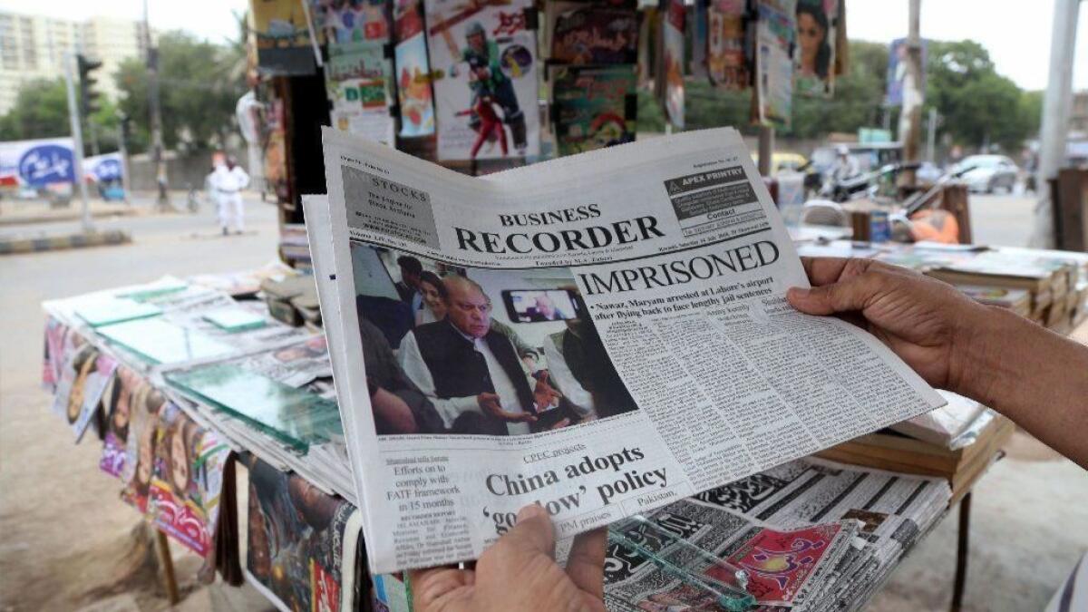 Pakistani newspapers carry front page news of the arrest of former Prime Minister Nawaz Sharif on July 14, 2018.