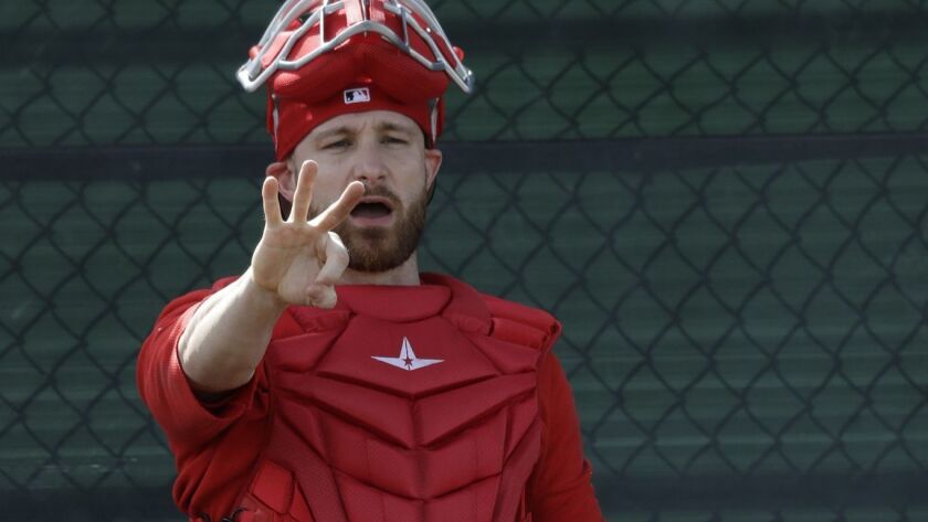Angels catcher Jonathan Lucroy gestures during practice at their spring baseball training facility in Tempe, Ariz., on Feb. 15.