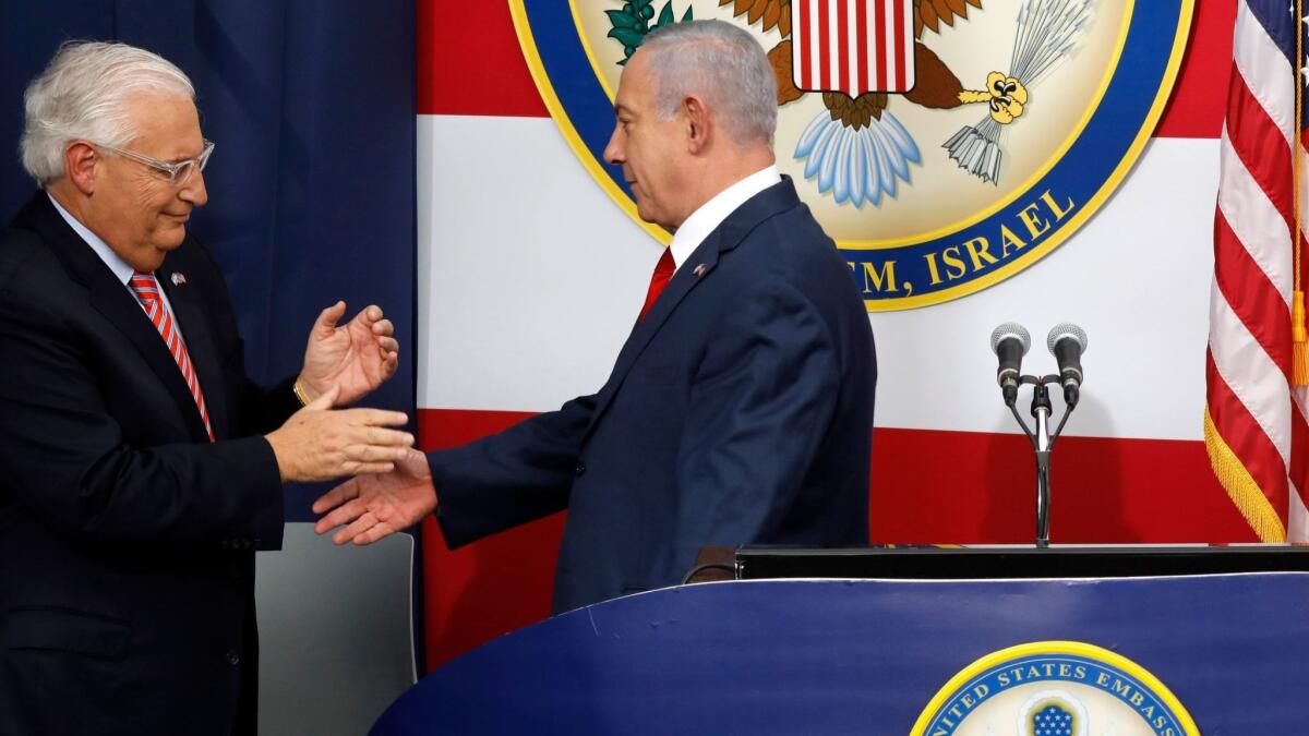 U.S. Ambassador to Israel David Friedman, left, and Israeli Prime Minister Benjamin Netanyahu on stage during the opening of the new U.S. Embassy in Jerusalem on May 14.