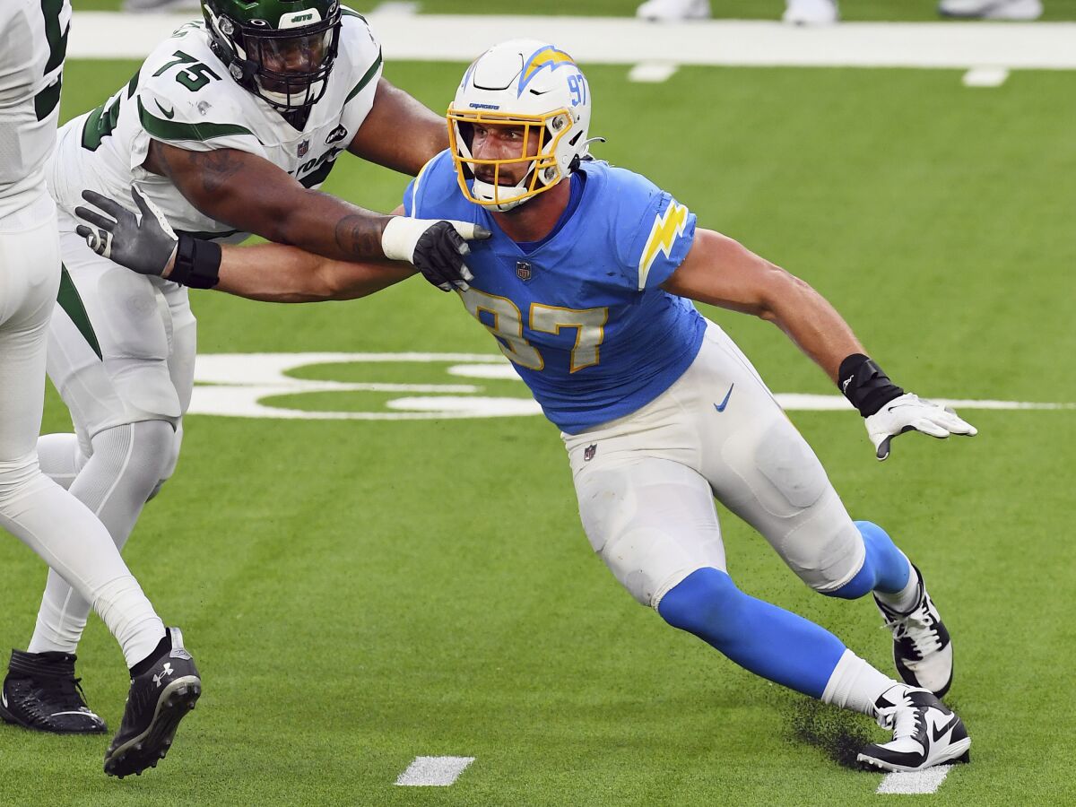 Los Angeles Chargers defensive end Joey Bosa rushes against the Jets' Chuma Edoga in game last month.