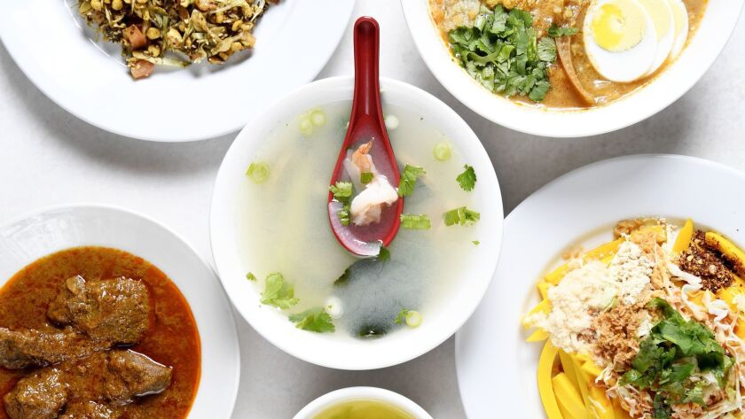 (From top-left, clockwise) Tea leaf salad, rice noodle fish soup, tofu salad, beef korma, tomyam chicken and shrimp soup.