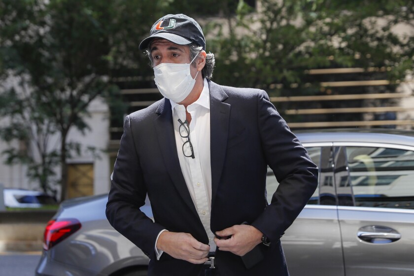 FILE- In this May 21, 2020 file photo, Michael Cohen arrives at his Manhattan apartment in New York after being furloughed from prison because of concerns over the coronavirus. A bound edition about President Donald Trump’s second impeachment will feature a foreword from an estranged associate _ former Trump attorney Michael Cohen. Skyhorse Publishing announced that “The Second Impeachment Report" comes out Feb. 9. (AP Photo/John Minchillo, File)