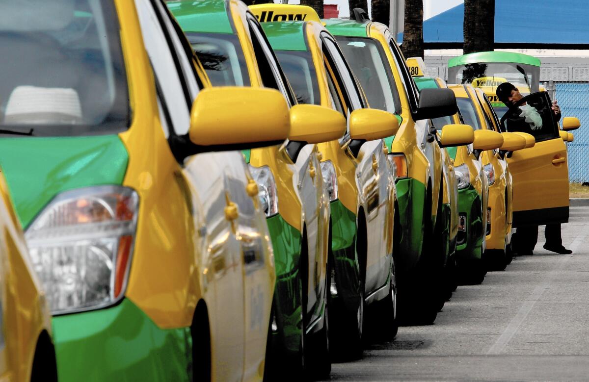 Taxis await passengers at Long Beach Airport. The Long Beach City Council voted to let Long Beach Yellow Cab, which holds the city's exclusive franchise agreement, to offer variable, discounted fares, free rides and other price promotions to lure customers.